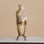 A 20th century French alabaster vase with gilt metal stand, rising just over 30 inches tall. Carved from softly veined...