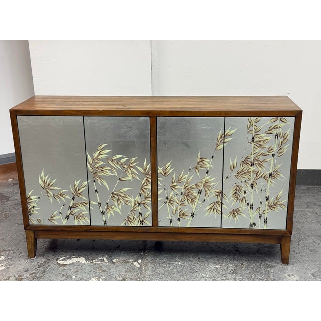 Design Plus Gallery presents the Shunan Sideboard from Theodore Alexander. The linear wood frame surrounds four mirrored...