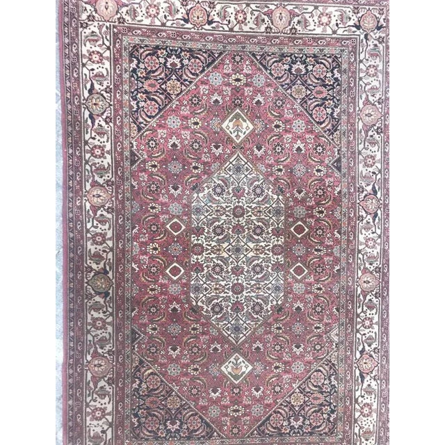 Nice 20th century rug with a beautiful Tabriz style design and pink field, blue and green colors. Entirely hand knotted...