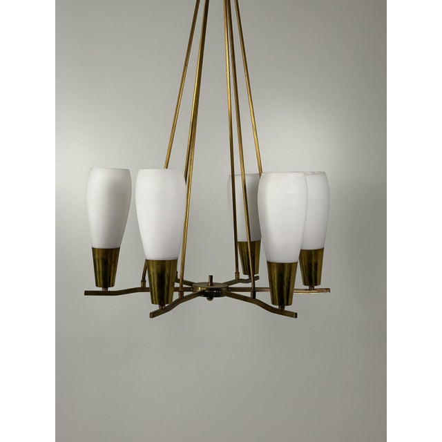 Glass and Brass Chandelier, 1950s , in Very Good conditions. Designed 1950 to 1959 Up to 250V (Europe/UK Standard).The...
