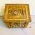 A striking antique-style English repoussé brass fireside box featuring beautifully detailed, high-relief embossed scenes...