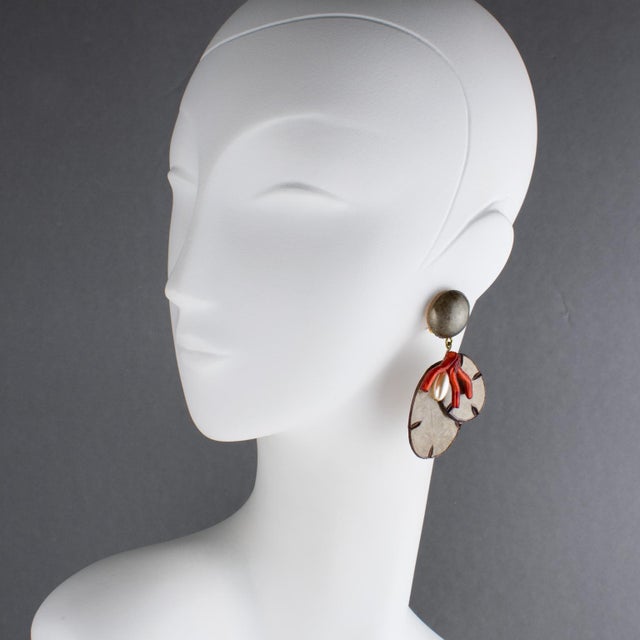 Cilea Paris designed these rare floral-inspired resin clip-on earrings. The lightweight artisanal resin pieces feature a...