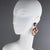 Cilea Paris designed these rare floral-inspired resin clip-on earrings. The lightweight artisanal resin pieces feature a...