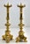 Antique pair of solid brass candlesticks. The solid brass is sharply cast and well defined, and are an identical pair....