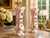 A beautifully preserved pair of antique hand-blown Bohemian cased art glass vases, featuring a luminous white exterior...