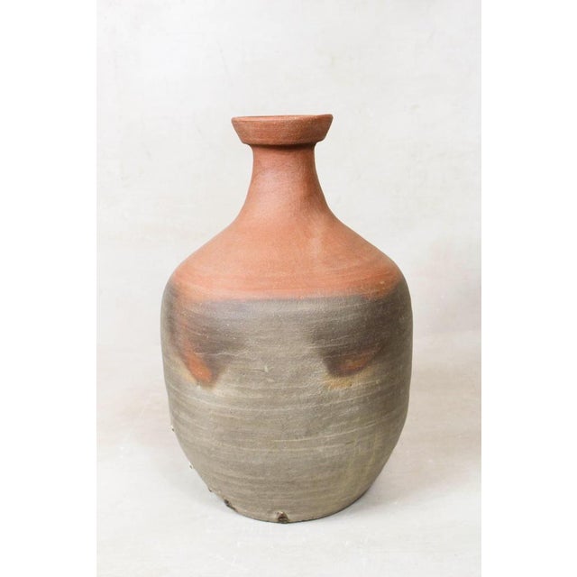 Unearth the past with this antique Asian rice wine clay container, a testament to the craftsmanship of a bygone era. Its...