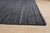 This gray wool rug features a hand knotted pile weave, offering a durable and practical solution for floor coverage....