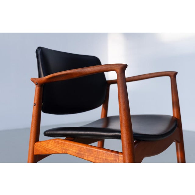 Danish Teak Captain's Chair by Erik Buck for Ørum, 1960s. Scandinavian Mid-Century Modern armchair in solid teak with...