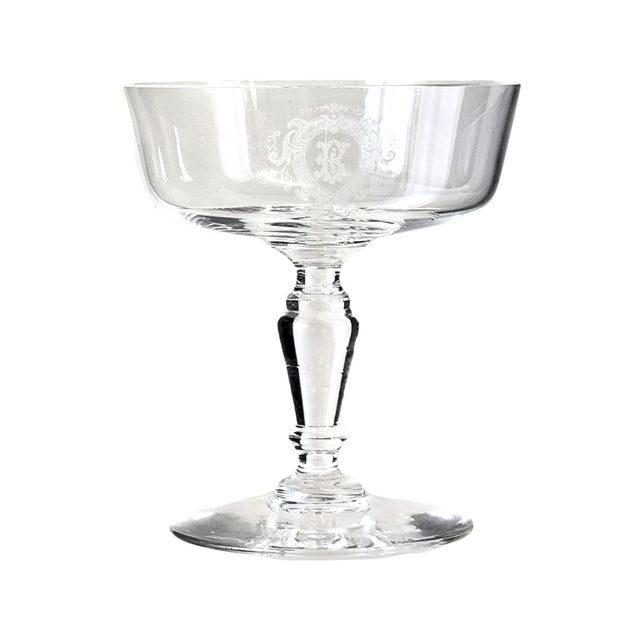 Set of six late 19th century French champagne coupes with elegant etched “B” monograms framed by decorative crests. The...