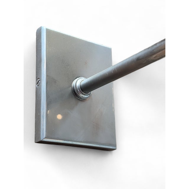 Phoenix Day Huntington stationary arm wall sconces. Fine cast brass construction with polished nickel finish. Wax candle...