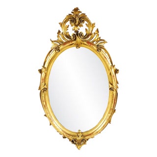 Large 19th Century Oval Mirror in Carved Gilt Wood For Sale
