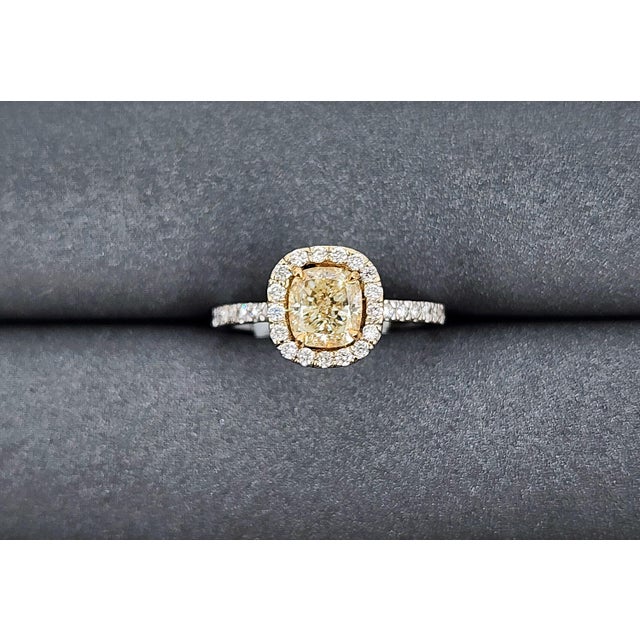 This stunning 18k natural yellow diamond ring weighs 1.59 ct. It features a beautiful natural yellow diamond in the...