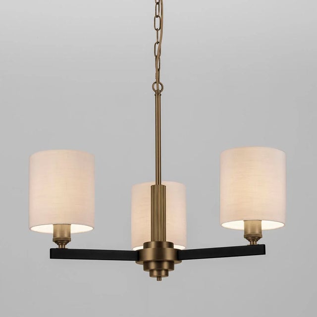 A Chandelier Which Is Transitional In Design Featuring Reeded Columns And Knurled Lampholder Covers.