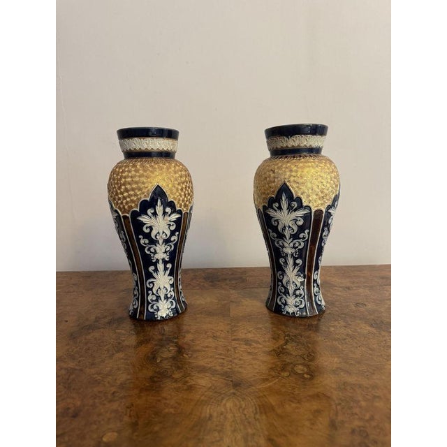 Fantastic quality garniture of antique Royal Doulton vases, having a quality garniture of three antique Royal Doulton...