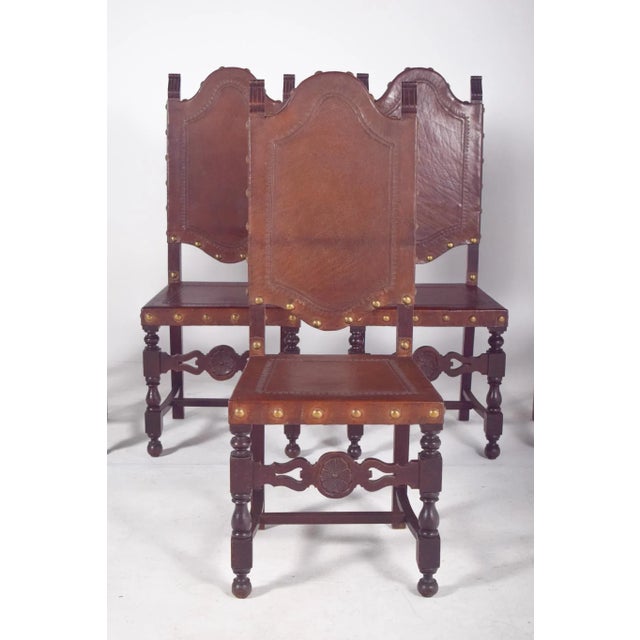Five antique chairs with leather seats and backs. Beautiful set of chairs from the 19th century, of remarkable presence...