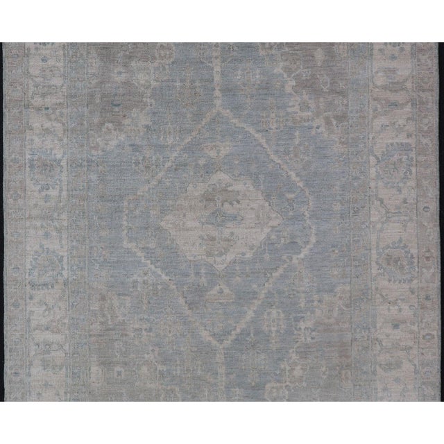 Tribal Modern Oushak With a Light Blue-Gray Background With Medallion & Tribal Motifs 5'10"x8'9" For Sale - Image 3 of 4