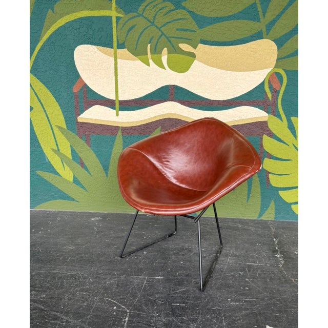 Authentic Bertoia for Knoll diamond chair with its original leather cover. In good vintage condition 33.5” w 27” d 31” h...