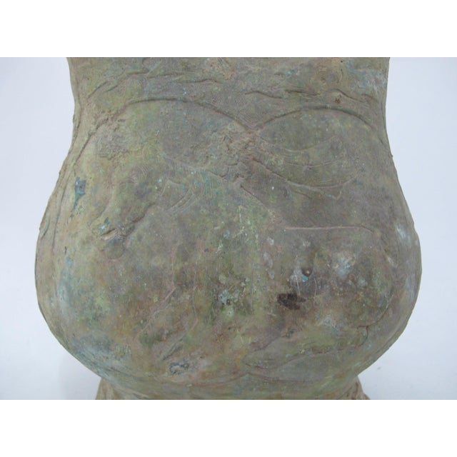Chinese bronze lidded kettle resembling vessels from the Warring States period, featuring a handle and distinct, heavy...