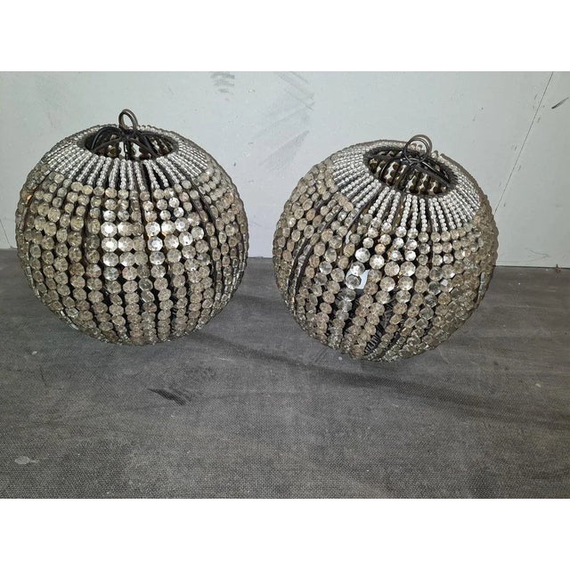 Cast iron basket with crystal glass applications. Electrification: simple power cable with lamp holder, fixed to the...