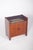 Small bar cabinet with two doors. The upper part has a dark glass top and, just below, a display area also made of glass,...