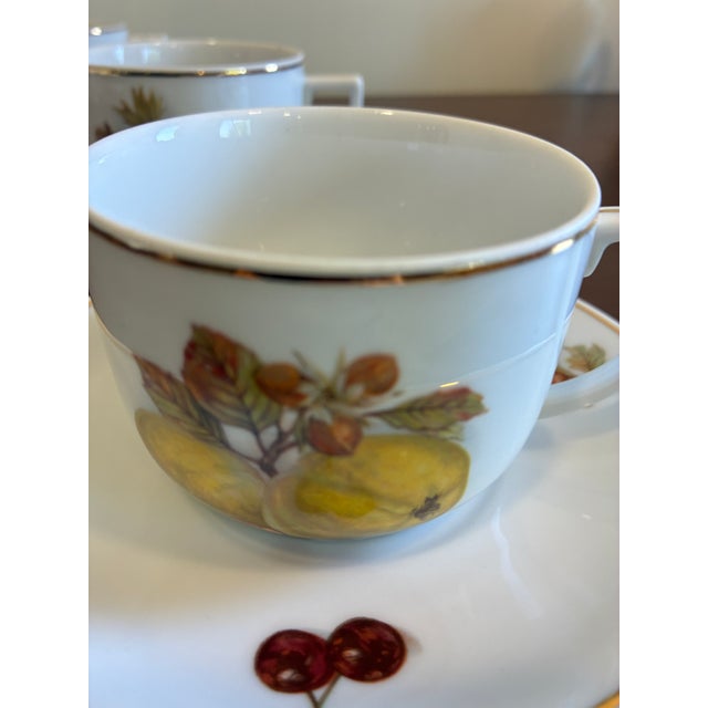 A delightful vintage Seltmann Weiden Bavaria porcelain tea cup and saucer set featuring assorted fruit motif artwork and...