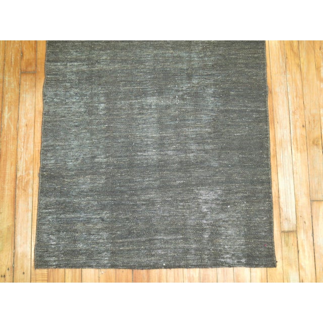 A one of a kind mid-20th century hand knotted Turkish Kilim runner in brown. Some wear showing Measures: 2'8" x 9'10".