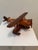 Handcrafted mid-century wooden model of a classic biplane seaplane, beautifully constructed from contrasting woods with an...