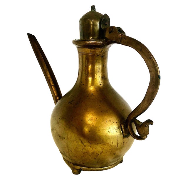 This item is a vintage brass Aftaba (also known as an Aftabeh or Surahi), a traditional water ewer historically used...
