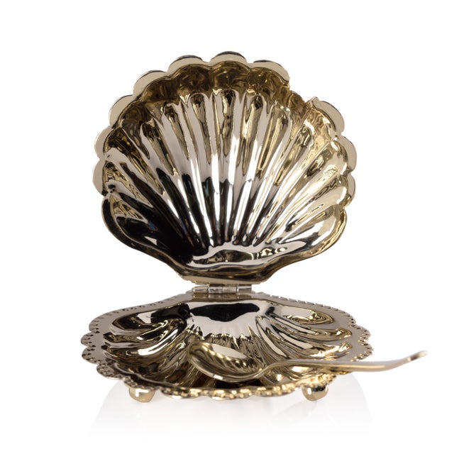 This exquisite clam shell-lidded bowl features a footed base and is crafted from food-grade brass with a shiny polished...