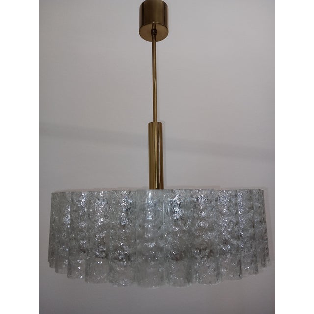 The chandelier is equipped with 32 transparent glass tubes (2 spare glass tubes also included) and 6x E27 sockets. The...