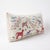 An extra-long lumbar pillow cover made from hand-embroidered Uzbek Suzani cotton — pink and blue horses among embroidered...