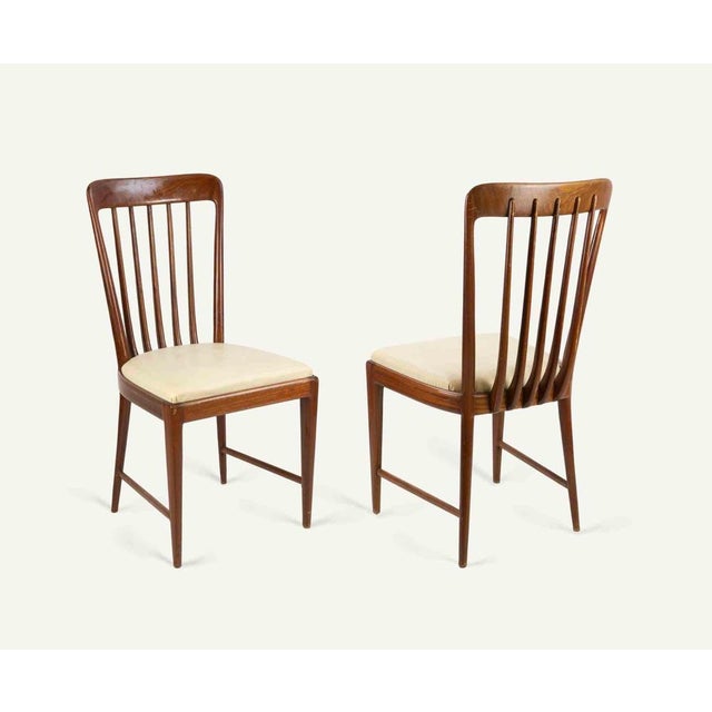 Beautiful set of chairs realized by italian manufacture in 1950s. Mahogany wood and padded leather. Very good condition.