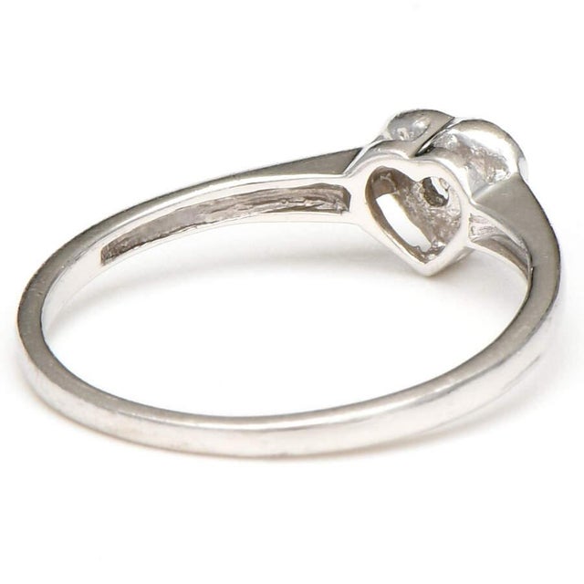 This pretty platinum heart ring has the power to charm almost anyone who encounters it. With an engaging diamond as the...