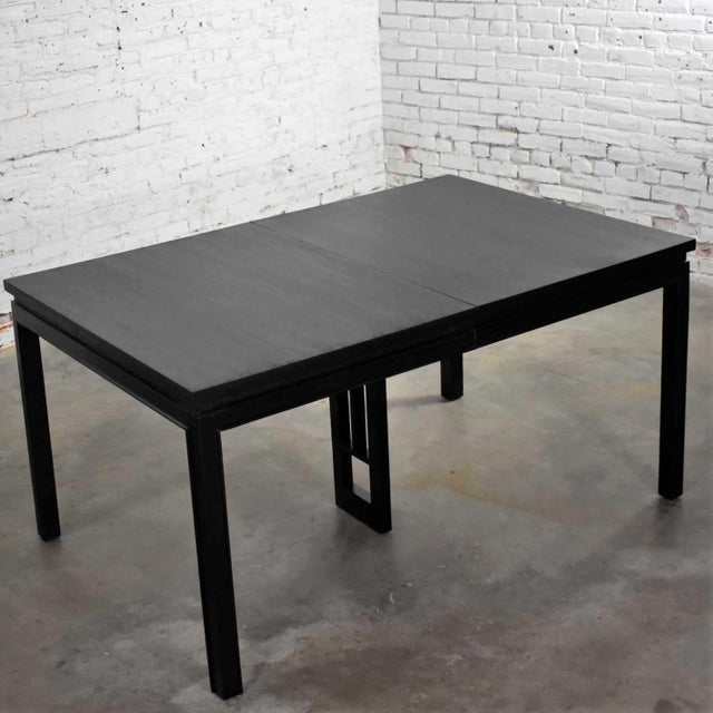 Handsome vintage MCM or Mid-Century Modern Asian Parson style extension dining table with a black painted finish and two...