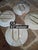 Collection of five fruit themed antique French Saint Clement Majolica plates with hangers currently on them. The yellow...
