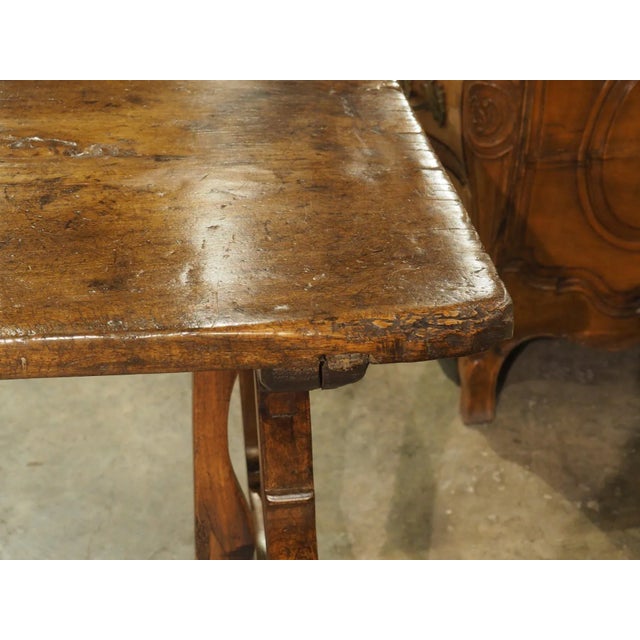 More information coming soon… Hand-carved in the 1600s, this walnut table features a single plank top supported by lyre...