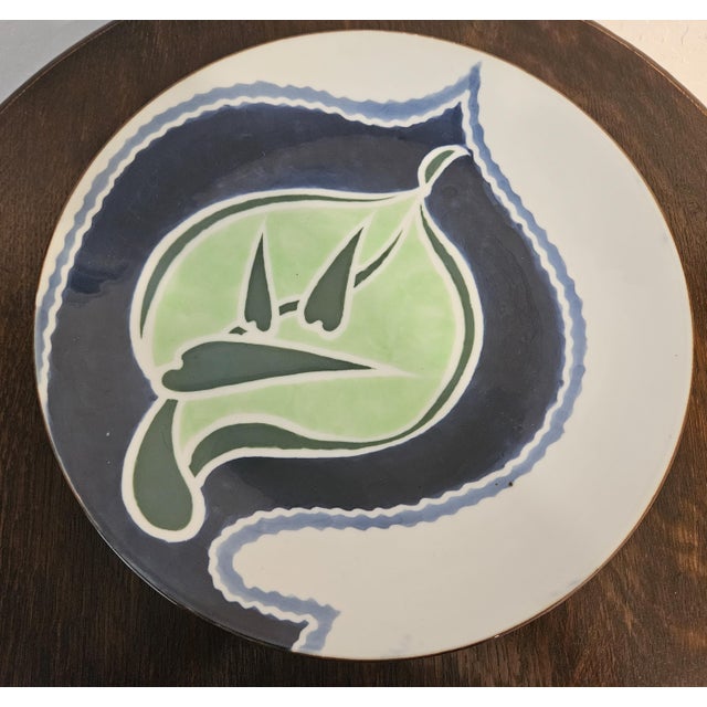 This vintage 1960s Japanese Studio Pottery Ceramic Serving Platter features a unique design within a round shape. The hand...