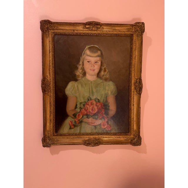 A charming vintage oil portrait of a young girl holding a bouquet of flowers, signed Easley in the lower right. Painted...