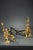 Pair of louis xv style andirons with rocaille decoration. They are decorated with ormolu and chased putti sitting on a...