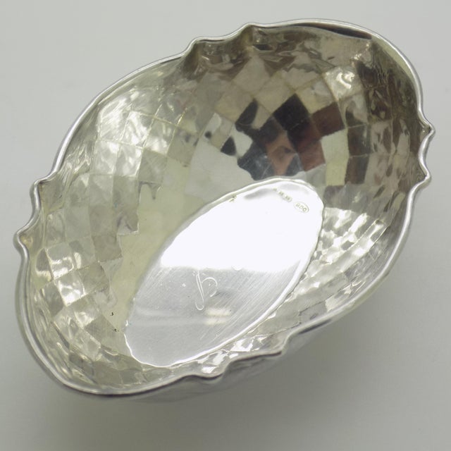 This vintage silver decorative object depicts a mini bowl coin tray, crafted as a ring dish, vitrine centerpiece, or desk...