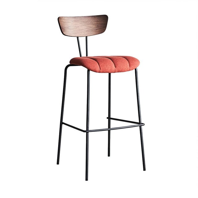 The Lara Bar Stool from Zentique is a modern bar-height stool with a curved walnut plywood backrest, channel-tufted rust-...
