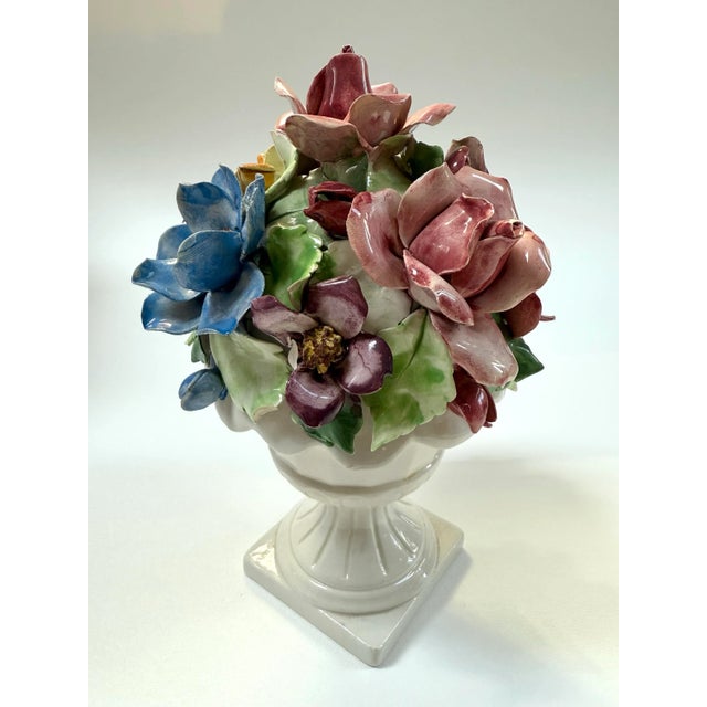 Vintage Italian Capodimonte style majolica lidded urn with delicate relief roses on top. This beautiful piece stands just...