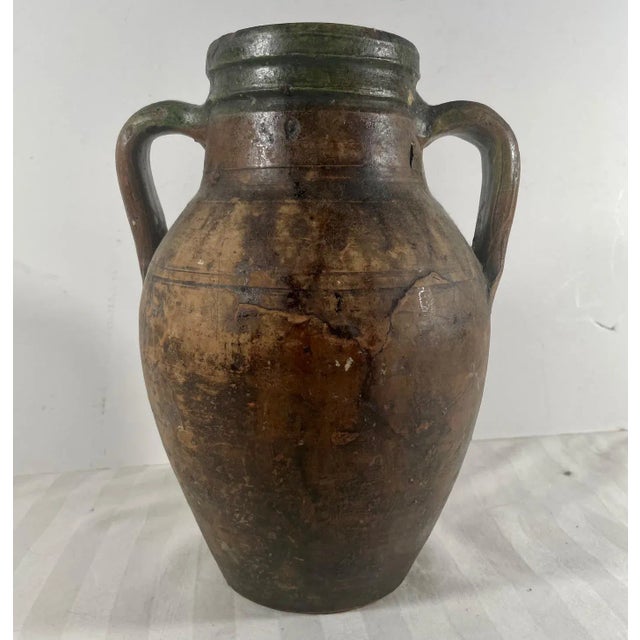 Antique Terracotta Amphora Olive Oil Pot. This European terracotta amphora was probably used for the storage and transport...