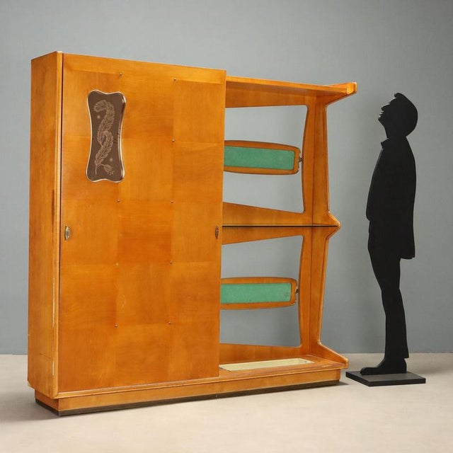 1950s entryway cabinet characterized by a functional and refined design, ideal for optimizing space in retro-style...