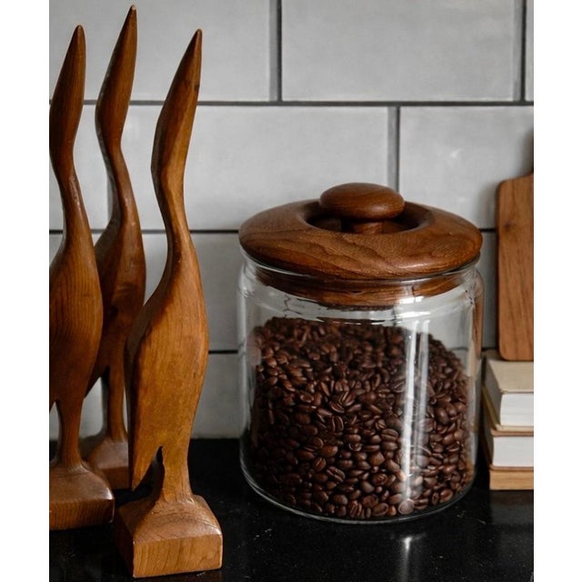 Three carved wood birds with simple mid-century lines and warm natural grain. 1960s.