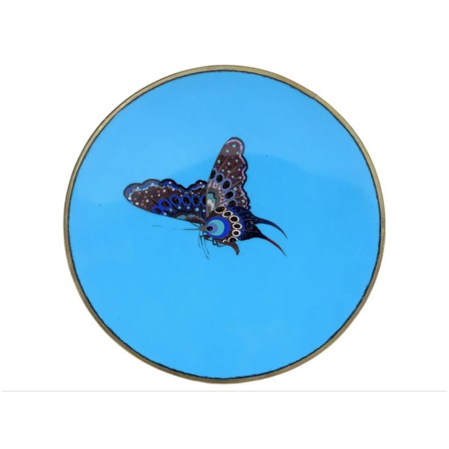 An antique Japanese Meiji period Circa 1895 cloisonne enamel metal charger plate depicting a highly detailed butterfly...
