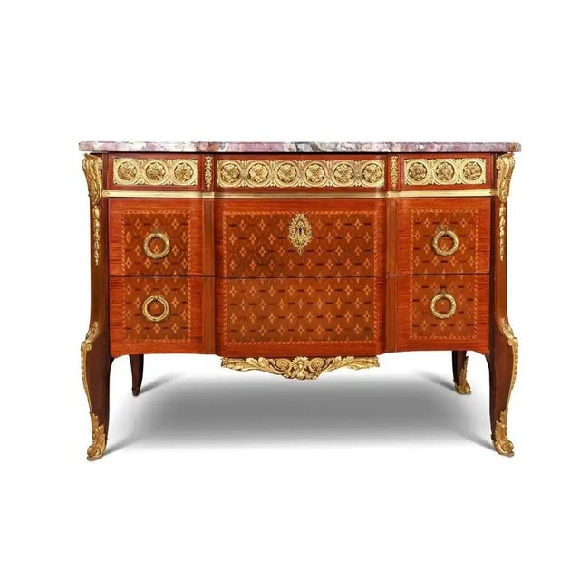 A very fine French 19th century finely chased ormolu-mounted kingwood, tulipwood, and satinwood marquetry and parquetry...