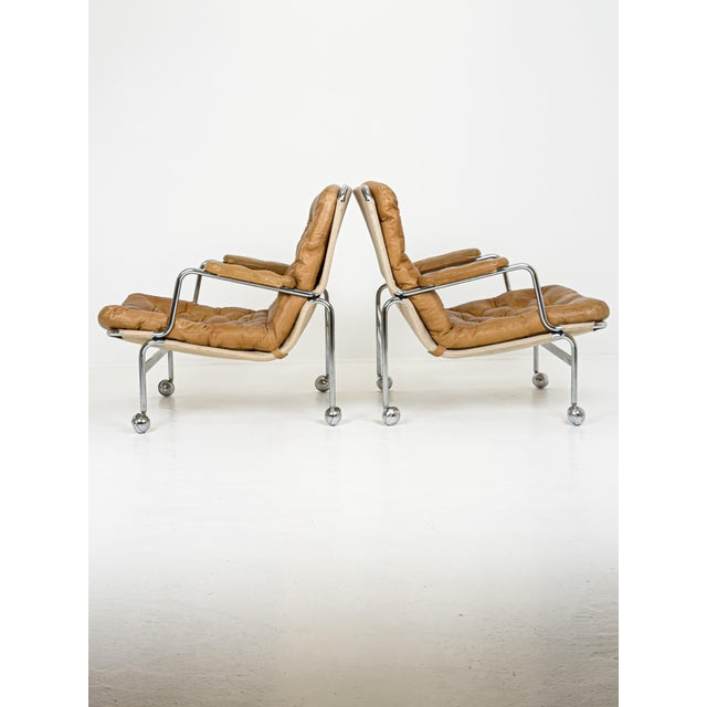 Karin Lounge Chairs in Leather by Bruno Mathsson for Dux, Sweden, 1970s, Set of 2, in Worn conditions. Designed 1960 to...