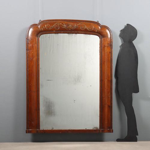 Freestanding mirror in walnut-stained poplar and fir. The cornice features gilded carvings featuring a central shell,...