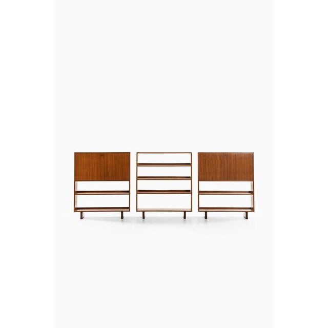 This rare set of freestanding bookcases and cabinets, designed by josef frank and produced by svenskt tenn in sweden,...